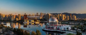 Vancouver skyline facing bright sunset
